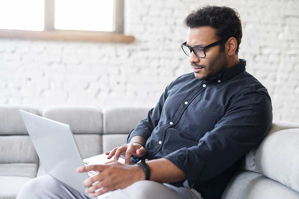 Man reading about cancer awareness online.